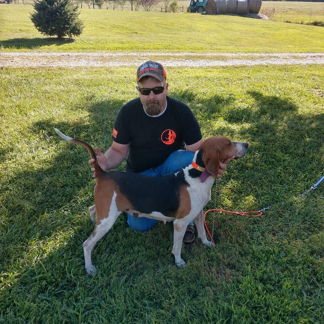 Ryan Walden, owner of Walden Farms Excavation and Landscaping, with his treeing walker hound