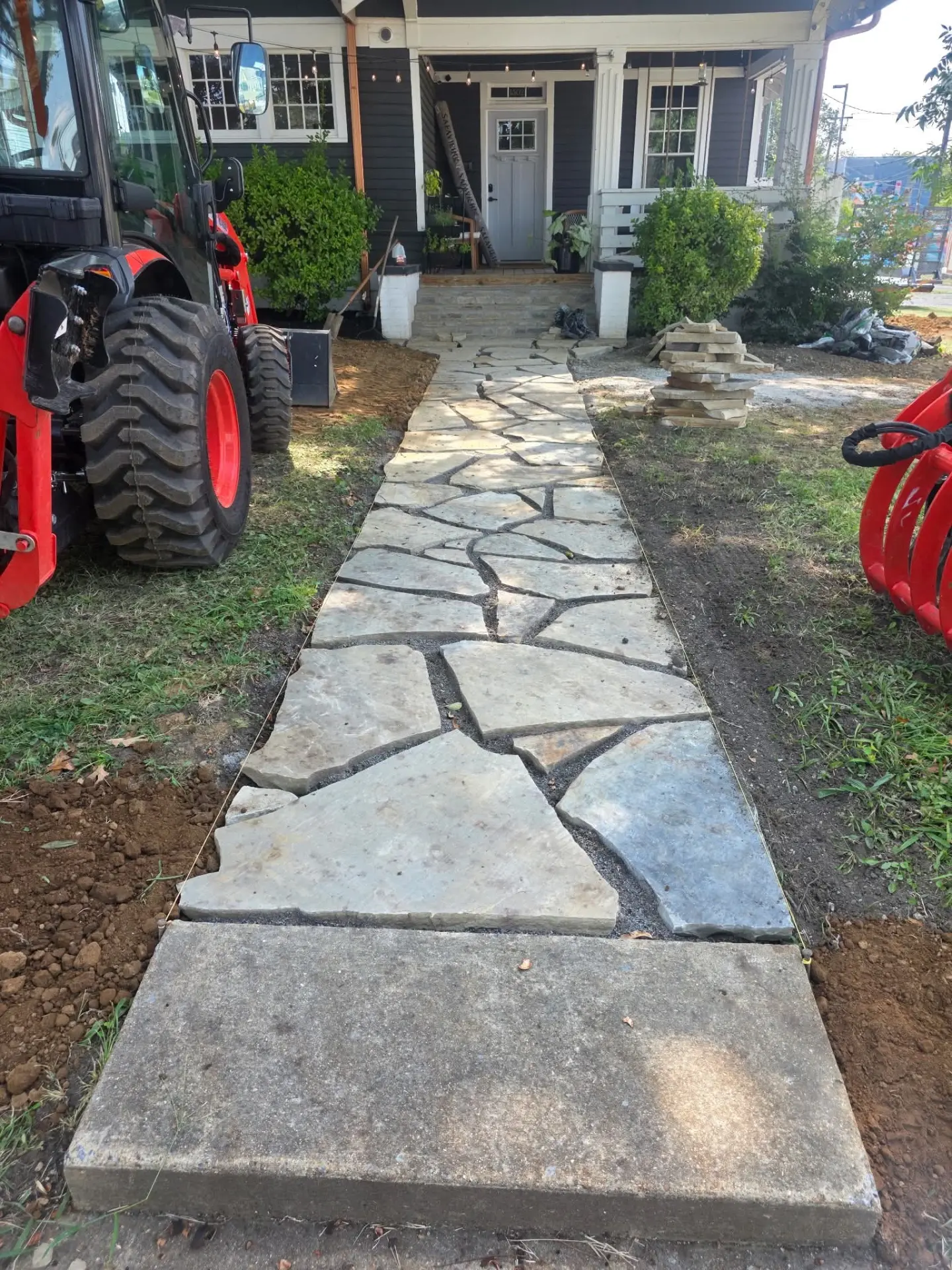 Newly laid flagstone walkway leading to a front porch